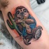 Neo traditional style colored biceps tattoo of slope with cactus