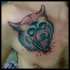 Neo traditional style colored chest tattoo of bloody demonic dog