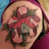 Neo traditional style colored shoulder tattoo of beautiful flower