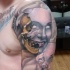 Neo traditional style colored shoulder tattoo of creepy mask with skull