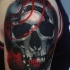 Neo traditional style colored shoulder tattoo fo human skull with ornaments