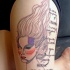 New school abstract thigh tattoo of woman with lettering
