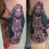 New school style colored arm tattoo of creepy Goddess with skulls