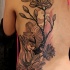 New school style colored back tattoo of beautiful flowers