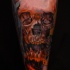 New school style colored bloody skull tattoo on arm