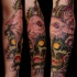 New school style colored forearm tattoo of demonic skull with goat helmet