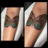 New school style colored forearm tattoo of fantasy butterfly