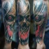 New school style colored forearm tattoo of demonic skull