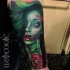 New school style shoulder tattoo of zombie woman with flowers