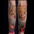 Tatuaje en el antebrazo,
cabeza de  aries misterioso en el fuego