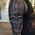 Nice looking colored arm tattoo of crazy monster clown face