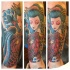 Nice looking colored Asian Aquarius woman with carp fish tattoo on forearm