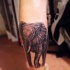 Tatuaje en el tobillo,  elefante imponente realista