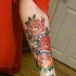 belli rose e scritta tatuaggio mezza manica