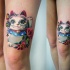 Nice sweet looking thigh tattoo of maneki neko japanese lucky cat statuette