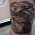 Old school black ink leg tattoo of dollars