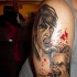 Old school cartoons style designed colored shoulder tattoo of bloody vampire man