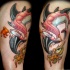 Old school multicolored thigh tattoo of funny fishes
