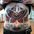 Old school style colored belly tattoo of butterfly with bones and skull