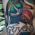 Old school style colored duck with lettering tattoo
