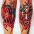 Old school style colored leg tattoo of red octopus with sailing ship