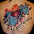 Old school style colored whole back tattoo of heart with flowers and lettering