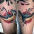 Old school style thighs tattoo of various harpooned sharks