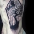 Original coffin shaped black ink side tattoo stylized with old castle and dark tree