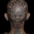 Ornamental style colored head tattoo of beautiful ornaments