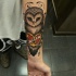 gufo e cuore con blocco avambraccio tatuaggio