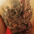 Tatuaje en la espalda, diseño de fénix grande