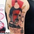 Photoshop style colored shoulder tattoo of Nikola Tesla with lettering and bulb