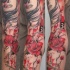 Photoshop style colored sleeve tattoo of mystic woman with lettering and flowers