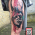 Photoshop style colored thigh tattoo of devils woman with ornaments