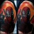 Picture like colored shoulder tattoo of angry Deadpool