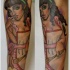 ragazza pin up dente dolce avambraccio tatuaggio