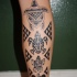 Tatuaggio grande sulla gamba le tartarughe in stile tribale