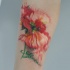 Tatuaggio sul braccio il papavero incantevole