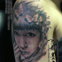 Portrait style black ink shoulder tattoo of Asian woman with butterflies
