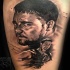 Portrait style black ink tattoo of Gladiator movie hero with lettering