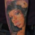 Portrait style colored arm tattoo of smoking seductive woman with flower
