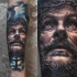 Portrait style colored Jesus face tattoo with dark sky and cross