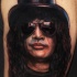 Portrait style colored shoulder tattoo of Slash face