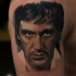 Portrait style colored shoulder tattoo of famous actor