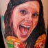 Portrait style colored smiling woman face tattoo with lollypops