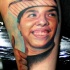 Portrait style colored tattoo of smiling boy face