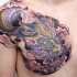 Lila Drache Tattoo an der Brust von Graynd