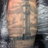 reale nero e bianco foto molto realistico vecchio faro tatuaggio su gamba