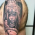 Real photo like shoulder tattoo of tribal woman portrait with shield