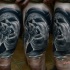 Real photo style black and white thigh tattoo of music singer